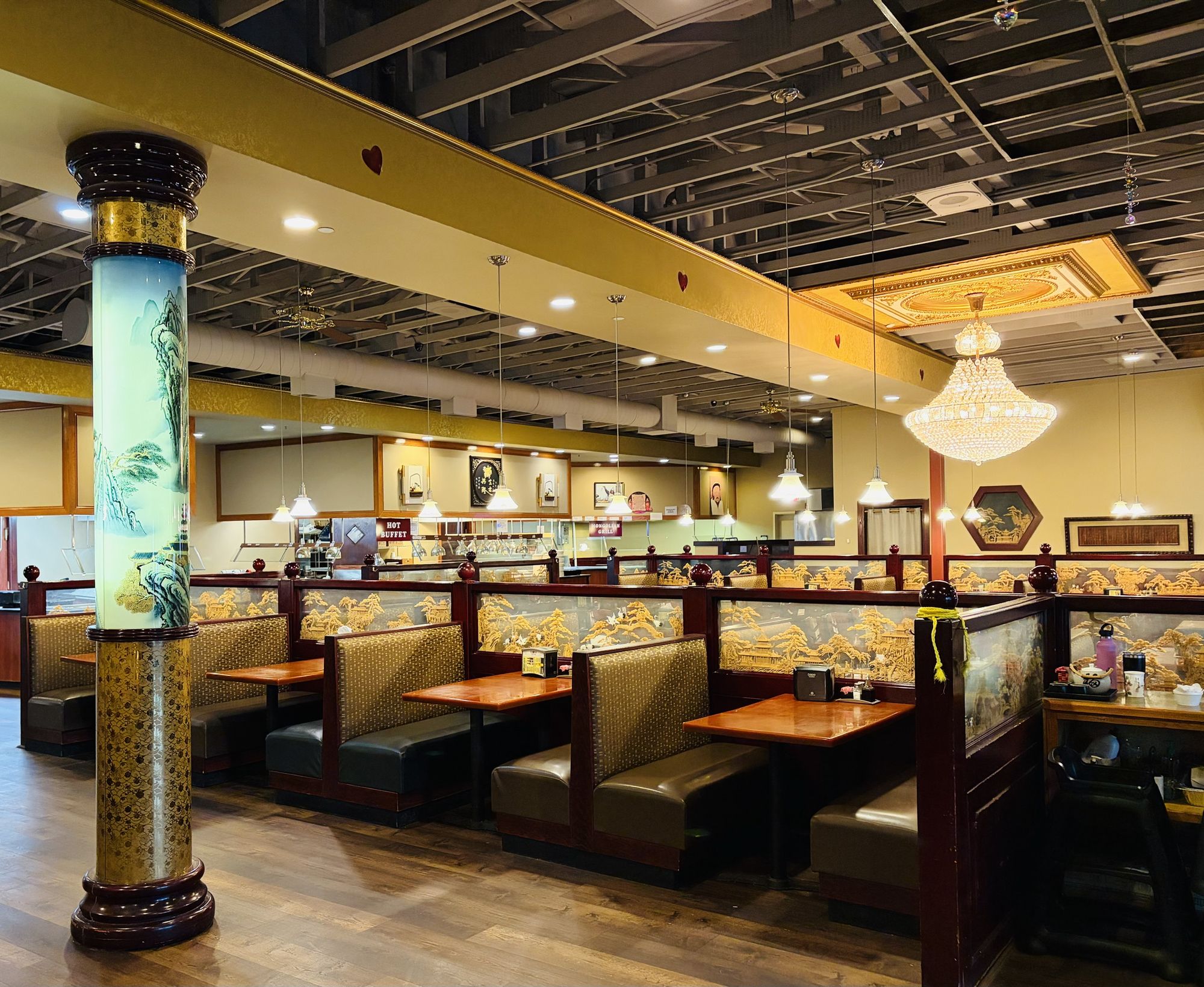 Our dining room with booths, a chandelier and the buffet in the back